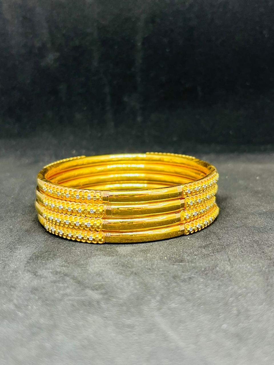 Twisted gold bangles