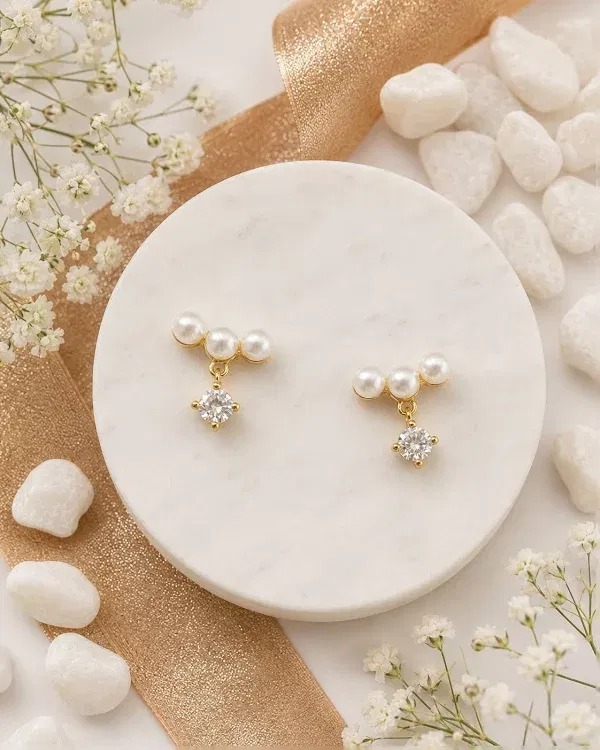 Pearl and gold stud earrings
