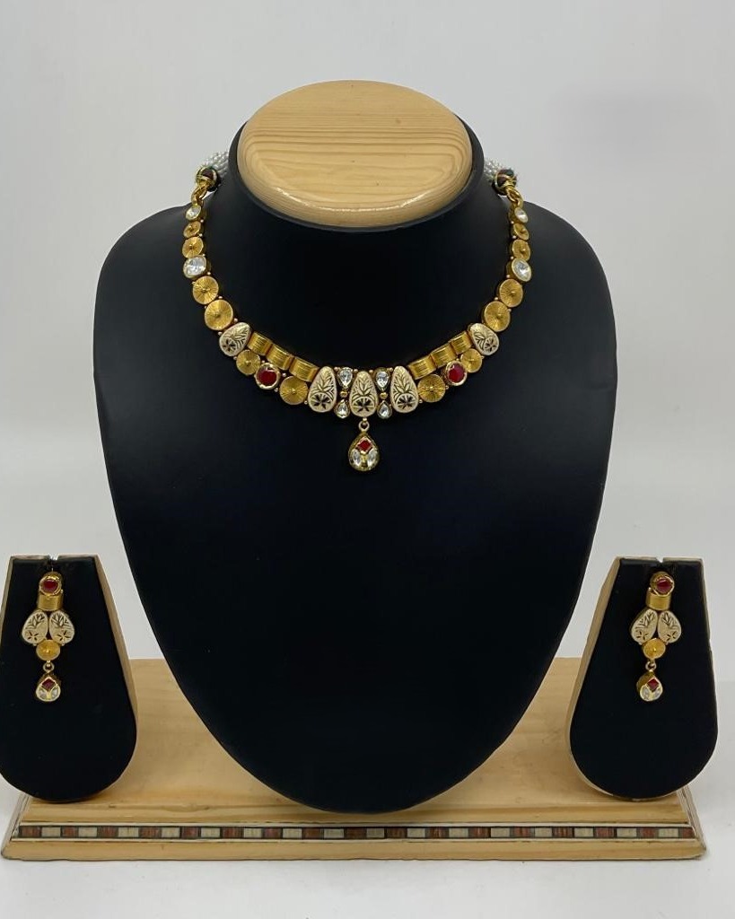 Sunburst disc kundan necklace set with ruby drop