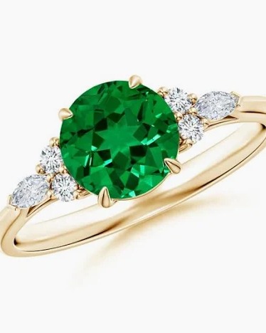 Round emerald ring with diamond accents